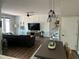 Modern living room with stylish decor, a comfortable sofa, and staircase at 310 S Willow Ave # A, Tampa, FL 33606