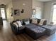 Spacious living room featuring a comfortable sectional sofa and a door to the exterior at 310 S Willow Ave # A, Tampa, FL 33606