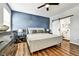 Well-lit main bedroom with sleek decor, accent wall, and access to a contemporary ensuite bathroom at 310 S Willow Ave # A, Tampa, FL 33606