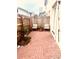 Charming brick patio featuring a cozy seating area with a wood fence at 310 S Willow Ave # A, Tampa, FL 33606
