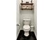 Quaint powder room with a sleek black and white design and unique shelving at 310 S Willow Ave # A, Tampa, FL 33606