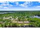 Breathtaking aerial view of lakeside condos surrounded by trees and water at 3145 Lake Ellen Dr # 3145, Tampa, FL 33618