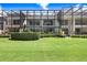 Beautiful backyard with a lush lawn and a screened enclosure on the back of the home at 3145 Lake Ellen Dr # 3145, Tampa, FL 33618