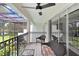 Tranquil balcony with seating and a ceiling fan, offering beautiful lake views at 3145 Lake Ellen Dr # 3145, Tampa, FL 33618