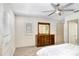Bright bedroom with a ceiling fan, shutters on the windows, and carpeted floors at 3145 Lake Ellen Dr # 3145, Tampa, FL 33618