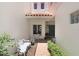 Charming courtyard entrance with a table, seating, and red brick pathway at 3145 Lake Ellen Dr # 3145, Tampa, FL 33618