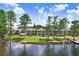 Beautiful lakeside condo with lush lawn, mature trees and dock access at 3145 Lake Ellen Dr # 3145, Tampa, FL 33618