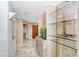 Inviting foyer with marble flooring, a decorative plant, and glass shelving at 3145 Lake Ellen Dr # 3145, Tampa, FL 33618