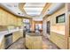 Spacious kitchen features granite countertops, stainless appliances, central kitchen island, and breakfast nook at 3145 Lake Ellen Dr # 3145, Tampa, FL 33618