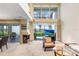 Spacious living room features high ceilings, large windows, fireplace, and access to outdoor patio at 3145 Lake Ellen Dr # 3145, Tampa, FL 33618