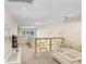 Bright living room with neutral decor, ceiling fan, and balcony view at 3145 Lake Ellen Dr # 3145, Tampa, FL 33618