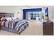 Spacious main bedroom with sliding glass doors to a balcony overlooking the water at 3145 Lake Ellen Dr # 3145, Tampa, FL 33618