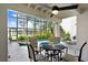 Enclosed pool with lake views, a spa, tropical plants, and an outdoor dining set under a ceiling fan at 3145 Lake Ellen Dr # 3145, Tampa, FL 33618
