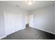 Bedroom with new carpet, closet, neutral paint, and modern lighting at 32599 Natural Bridge Rd, Wesley Chapel, FL 33543
