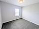 Cozy bedroom with new carpet, neutral paint, and natural light at 32599 Natural Bridge Rd, Wesley Chapel, FL 33543