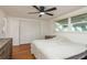 Main bedroom features hardwood floors, closet space, and natural light at 3547 Morley Dr, New Port Richey, FL 34652