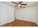 Bedroom features wood flooring, closet space and natural light at 3547 Morley Dr, New Port Richey, FL 34652