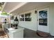 Cozy front porch with decorative lanterns and a secure front door, offering a welcoming entrance to the home at 3547 Morley Dr, New Port Richey, FL 34652