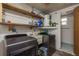 Laundry room with washer, dryer, shelving, utility sink, and water heater at 3547 Morley Dr, New Port Richey, FL 34652