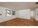 Inviting living room with large windows offering natural light and beautiful hardwood floors throughout the home at 3547 Morley Dr, New Port Richey, FL 34652