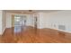 The spacious living room is open and bright, with hardwood floors and access to the outdoor patio at 3547 Morley Dr, New Port Richey, FL 34652