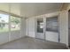 Enclosed sun room features large windows for natural light and access to the outdoors at 3547 Morley Dr, New Port Richey, FL 34652