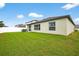 Spacious backyard with healthy grass, a white privacy fence, and a well-maintained exterior at 36618 Garden Wall Way, Zephyrhills, FL 33541