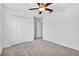 Bedroom with ceiling fan, carpet floors, and closet at 36618 Garden Wall Way, Zephyrhills, FL 33541