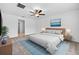 Bedroom with ceiling fan, neutral carpet, and ensuite access at 36618 Garden Wall Way, Zephyrhills, FL 33541