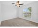 Bedroom with carpet flooring and a window providing natural light at 36618 Garden Wall Way, Zephyrhills, FL 33541