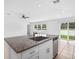 Kitchen island featuring granite countertops, stainless steel appliances, and sink at 36618 Garden Wall Way, Zephyrhills, FL 33541