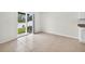 Bright room with tile flooring, sliding glass doors, and view of the backyard at 36618 Garden Wall Way, Zephyrhills, FL 33541
