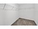 Walk-in closet with carpet flooring and metal shelving at 36618 Garden Wall Way, Zephyrhills, FL 33541