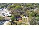The house and property are surrounded by homes and trees in this high angle shot from above at 4009 N 15Th St, Tampa, FL 33610