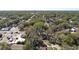 An overhead shot shows the home and property surrounded by lush trees and other homes nearby at 4009 N 15Th St, Tampa, FL 33610