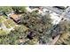 Aerial view of the home with mature trees, surrounded by other houses and streets at 4009 N 15Th St, Tampa, FL 33610