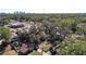 Aerial view showing mature trees and landscape plus nearby businesses at 4009 N 15Th St, Tampa, FL 33610