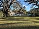 The backyard features mature trees and lots of green space at 4009 N 15Th St, Tampa, FL 33610