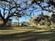 The front lawn has mature trees and space at 4009 N 15Th St, Tampa, FL 33610