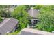 An aerial view of apartments surrounded by mature trees at 4012 Tumble Wood Trl # 104, Tampa, FL 33613