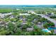 Community nestled among mature landscaping featuring pool and tennis courts at 4012 Tumble Wood Trl # 104, Tampa, FL 33613