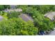 An aerial view of several units and mature trees at 4012 Tumble Wood Trl # 104, Tampa, FL 33613