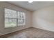 Bright bedroom featuring tile floors and a large window at 4012 Tumble Wood Trl # 104, Tampa, FL 33613