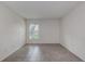 Cozy bedroom featuring neutral paint, tile floors and a bright window at 4012 Tumble Wood Trl # 104, Tampa, FL 33613