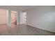 Spacious bedroom with neutral walls and tile floors, and doorways to other rooms at 4012 Tumble Wood Trl # 104, Tampa, FL 33613