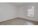 Bedroom featuring tile floors, neutral paint, and a bright window at 4012 Tumble Wood Trl # 104, Tampa, FL 33613