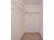 Spacious bedroom closet featuring tile floors and wire shelving at 4012 Tumble Wood Trl # 104, Tampa, FL 33613