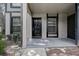 Inviting entrance with a solid front door and ample natural light from nearby windows at 4012 Tumble Wood Trl # 104, Tampa, FL 33613