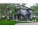 Inviting two-story apartment building featuring well-maintained landscaping and secure stairwell access at 4012 Tumble Wood Trl # 104, Tampa, FL 33613