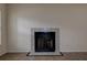 Close-up of a cozy fireplace in the living room with tile surround at 4012 Tumble Wood Trl # 104, Tampa, FL 33613